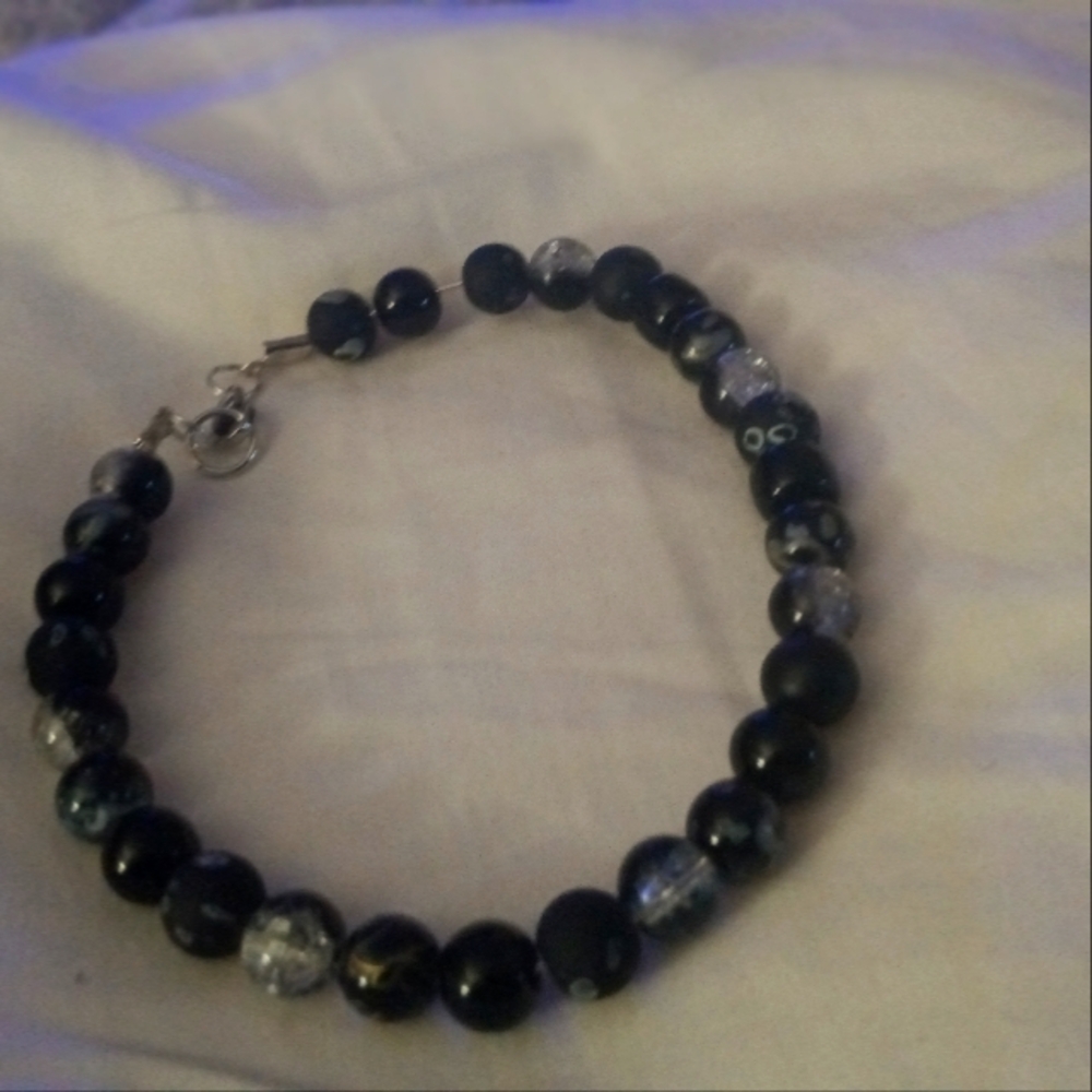 Handmade bracelet it's beaded black and gray. Adorable with every penny